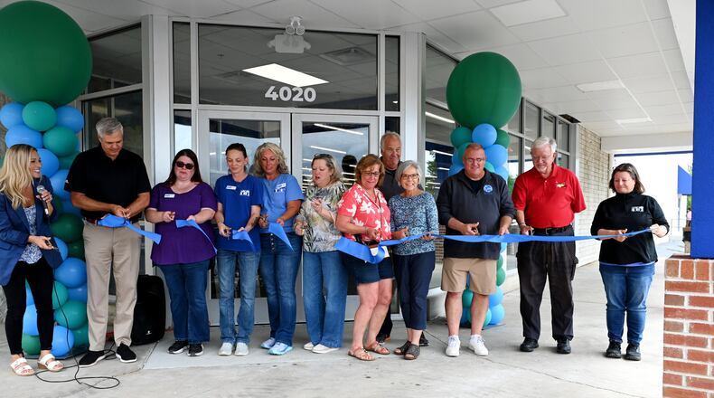 The new 24,000-square-foot St. Vincent de Paul thrift store and donation center in Hamilton replaces the former Pleasant Treasures indoor flea market. The newest SVDP thrift store and donation center is also its third-largest (the Western Hills and Milford stores are the first- and second-largest, respectively). Pictured is the ribbon cutting at the store on Thursday, Aug. 21, 2025, a day before it opened on Friday, Aug. 22, 2025. MICHAEL D. PITMAN/STAFF