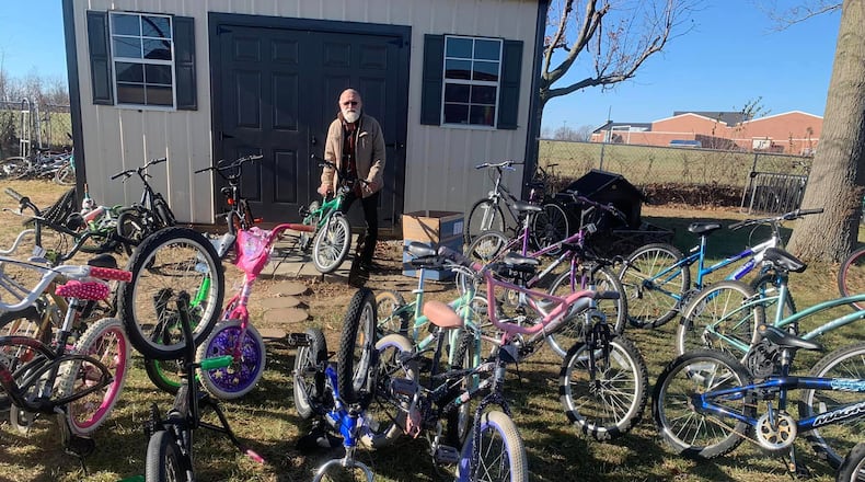 David Nugent with a few of the bikes he has repaired and that are ready for children to ride.