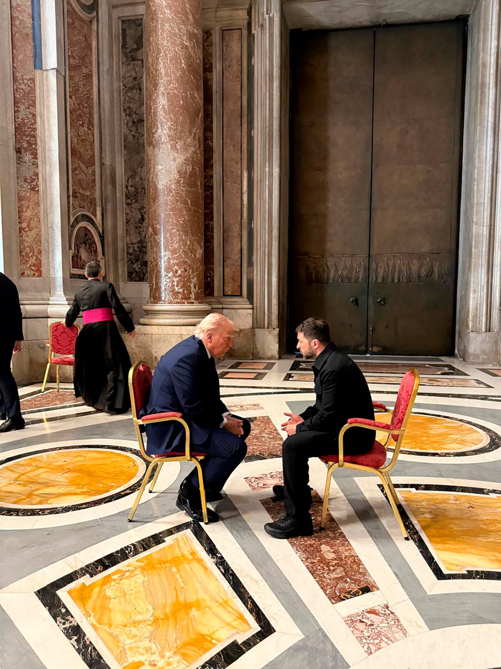 In this photo provided by the Ukrainian Presidential Press Office, Ukraine's President Volodymyr Zelenskyy, right, and President Donald Trump, talk as they attend the funeral of Pope Francis in Vatican, Saturday, April 26, 2025.(Ukrainian Presidential Press Office via AP)