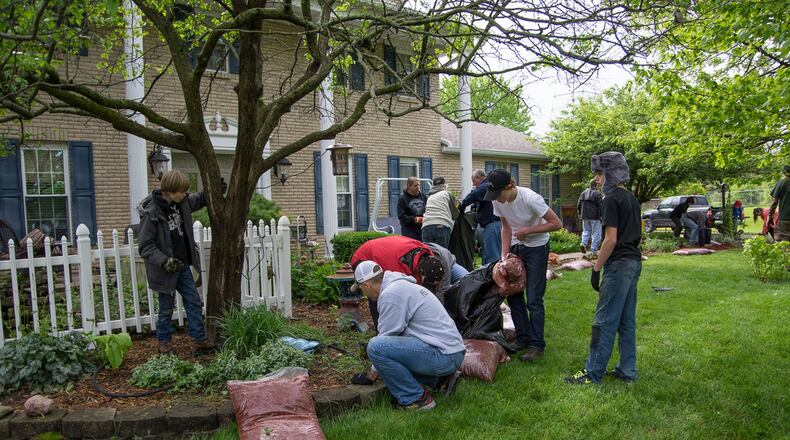 West Chester Twp. residents do chores for the elderly during the semi-annual Random Acts of Simple Kindness Affecting Local Seniors (RASKALS) event.