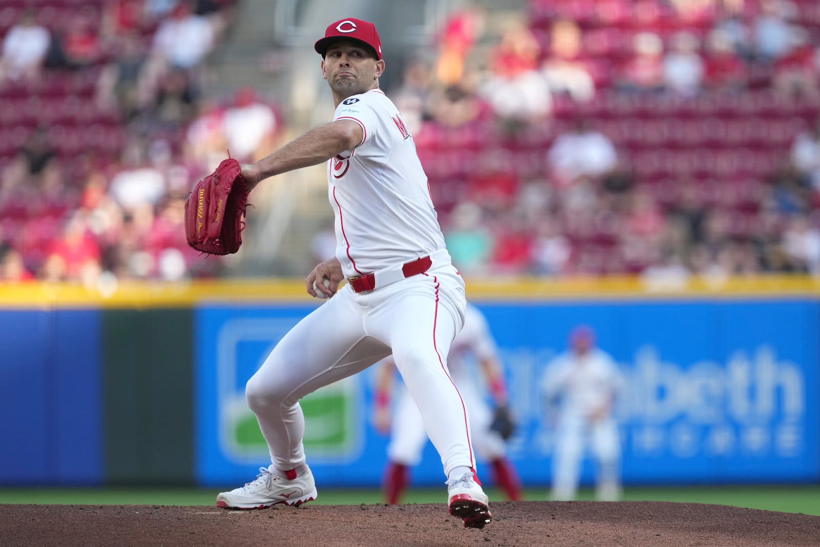 Cincinnati Reds' Nick Martinez delivers a pitch in the first inning of a baseball game against the St. Louis Cardinals, Monday, April 28, 2025, in Cincinnati. (AP Photo/Kareem Elgazzar)