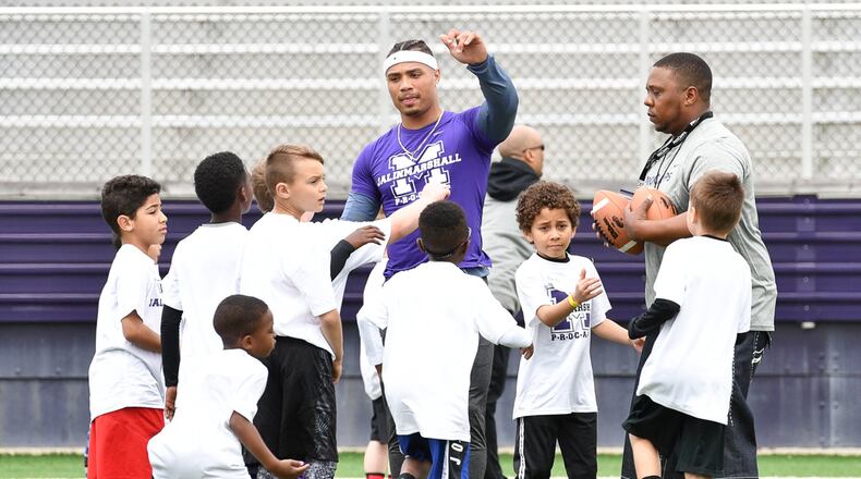 Former Middletown star and current New York Jet receiver Jalin Marshall leads a huddle with area elementary school students during a football camp on Sunday afternoon at Barnitz Stadium. Contributed Photo by Bryant Billing
