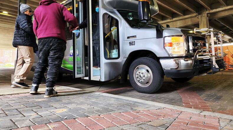 Riders get on a Butler County Regional Transit Authority bus on Market Street Tuesday, April 19, 2022 in Hamilton. Butler County Regional Transit Authority is surveying riders about possible changes to service. NICK GRAHAM/STAFF