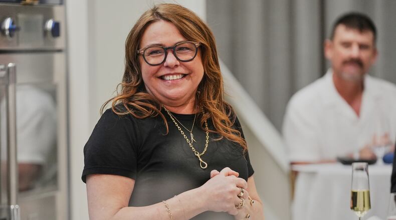Rachael Ray smiles while cooking at a private dinner during the South Beach Wine and Food Festival Friday, Feb. 20, 2026, in Miami. (AP Photo/Marta Lavandier)