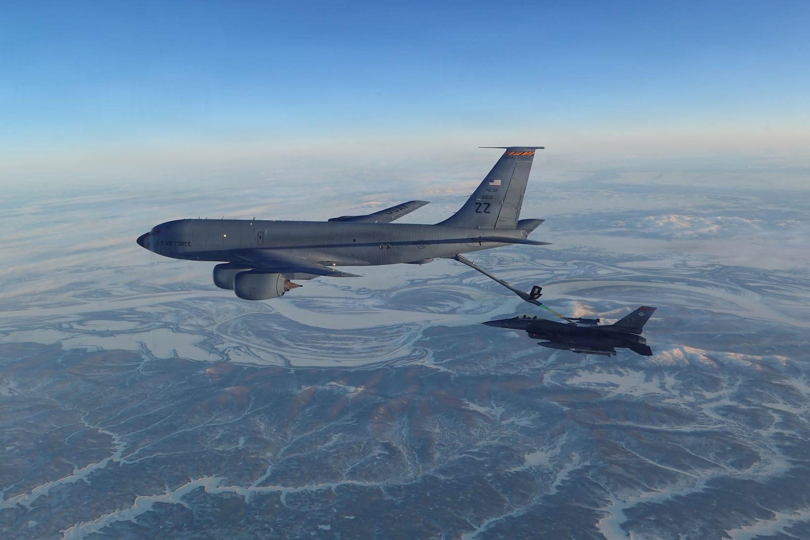 This photo provided by the U.S. Department of Defense shows a North American Aerospace Defense Command F-16 fighter refueling from a KC-135 Stratotanker over western Alaska on Thursday, Feb. 19, 2026. (U.S. Department of Defense via AP)
