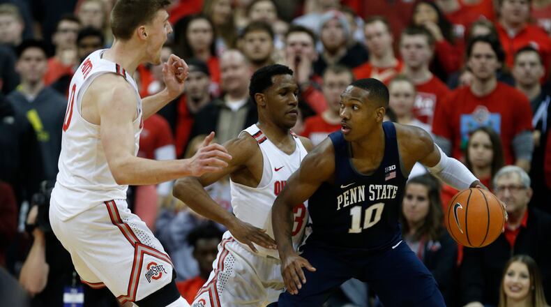 Penn State guard Tony Carr, right, works against Ohio State guard C.J. Jackson, center, and center Micah Potter during an NCAA college basketball game in Columbus, Ohio, Thursday, Jan. 25, 2018. Penn State won 82-79. (AP Photo/Paul Vernon)