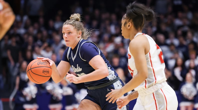 Fairmont senior forward Lena Buskard dribbles with pressure from Princeton's Heaven Sneed during the first half of the Division I state final on Saturday, March 14 at University of Dayton Arena. BRYANT BILLING / STAFF