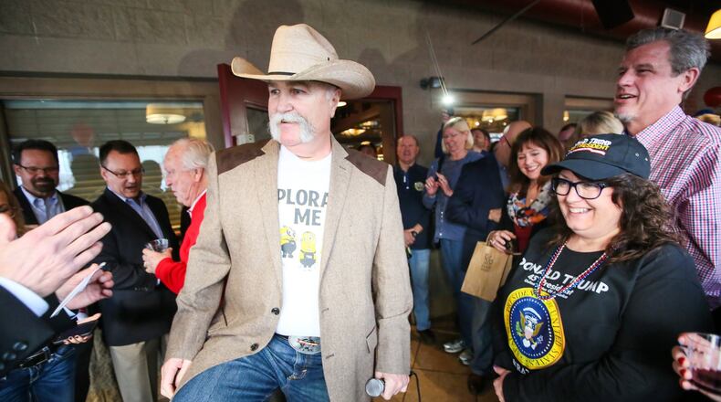 Butler County Sheriff Richard Jones leads the pack of countywide elected officials with money in the bank and most money raised this campaign finance reporting cycle. Pictured is Jones in January firing up the crowd during a Donald J. Trump inauguration celebration at Uno’s restaurant in West Chester Twp. GREG LYNCH / STAFF
