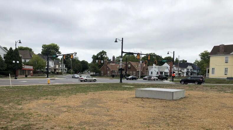 The base for the sculpture, Embrace, already is installed. The sculpture itself should arrive in coming weeks. MIKE RUTLEDGE/STAFF