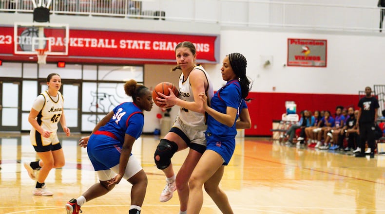 Monroe's Ryan Buskirk drives the lane against Woodward during a Division III district semifinal game on Tuesday night at Princeton. AJ FULLAM / CONTRIBUTED