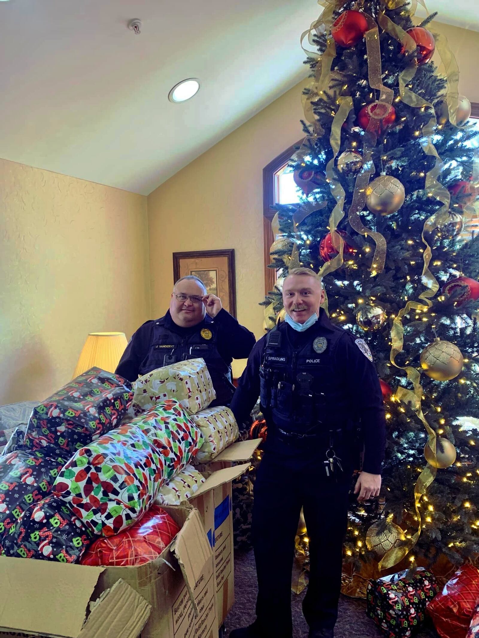 The Fairfield Twp. Police Department purchased gifts for the 64 residents at Birchwood Care Center, a nursing facility in the township. Pictured Sgt. John VandeRyt (left) and Detective Nic Spalding among the gifts residents received. PROVIDED