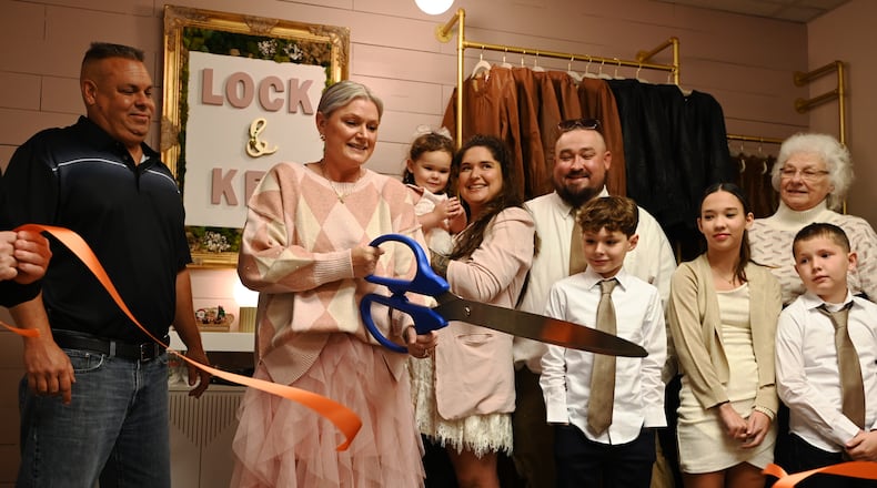 Lock and Key Boutique opens on Main Street in Hamilton, Ohio, on Nov. 16, 2024. Pictured are scenes from the ribbon cutting event held on Nov. 15, 2024, at its location, 408 Main St. MICHAEL D. PITMAN/STAFF