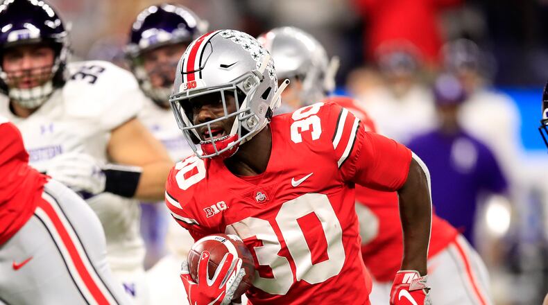 INDIANAPOLIS, INDIANA - DECEMBER 01: Demario McCall #30 of the Ohio State Buckeyes runs the ball against the Northwestern Wildcats in the first quarter at Lucas Oil Stadium on December 01, 2018 in Indianapolis, Indiana. (Photo by Andy Lyons/Getty Images)