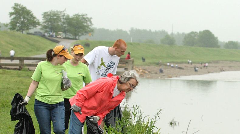 Volunteers look for litter while participating in a previous Clean Sweep of the Great Miami River.