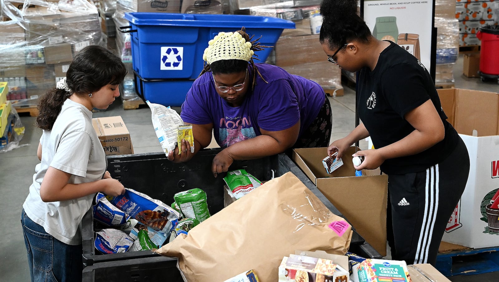 Pictured are volunteers at Shared Harvest Foodbank in Fairfield, Ohio, on Wednesday, July 9, 2025, packaging food in preparation for distribution. The federal cut to Supplemental Nutrition Assistance Program, or SNAP, benefits with the passage of the so-called "One Big Beautiful Bill" approved by Congress and signed by President Donald Trump, organizations like Shared Harvest expect to see an increase in clients as federal food supplies decrease. "Our greatest concern is that we continue in the pattern of reducing food sources, and we continue to see growing numbers of people coming to our network,” said Shared Harvest Executive Director Terry Perdue. “It’s less food and more people needing access to charitable food.” MICHAEL D. PITMAN/STAFF