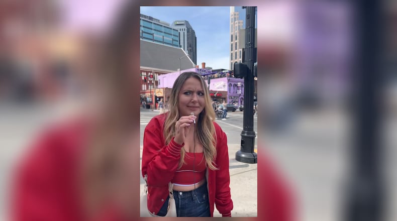 A woman on Broadway in Nashville calls the Cincinnati Bengals the "Boston Bobcats." SCREEN/CONTRIBUTED