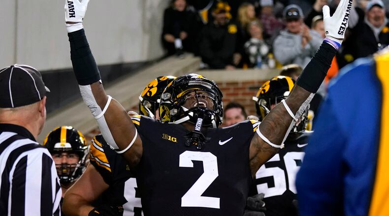 Iowa running back Kaleb Johnson celebrates after scoring on a 30-yard touchdown run in the second half of an NCAA college football game against Illinois, Nov. 18, 2023, in Iowa City, Iowa. Johnson, a Hamilton High School product, rushed for 113 yards and two TDs in Iowa's season-opening win over Illinois State on Saturday. (AP Photo/Charlie Neibergall)