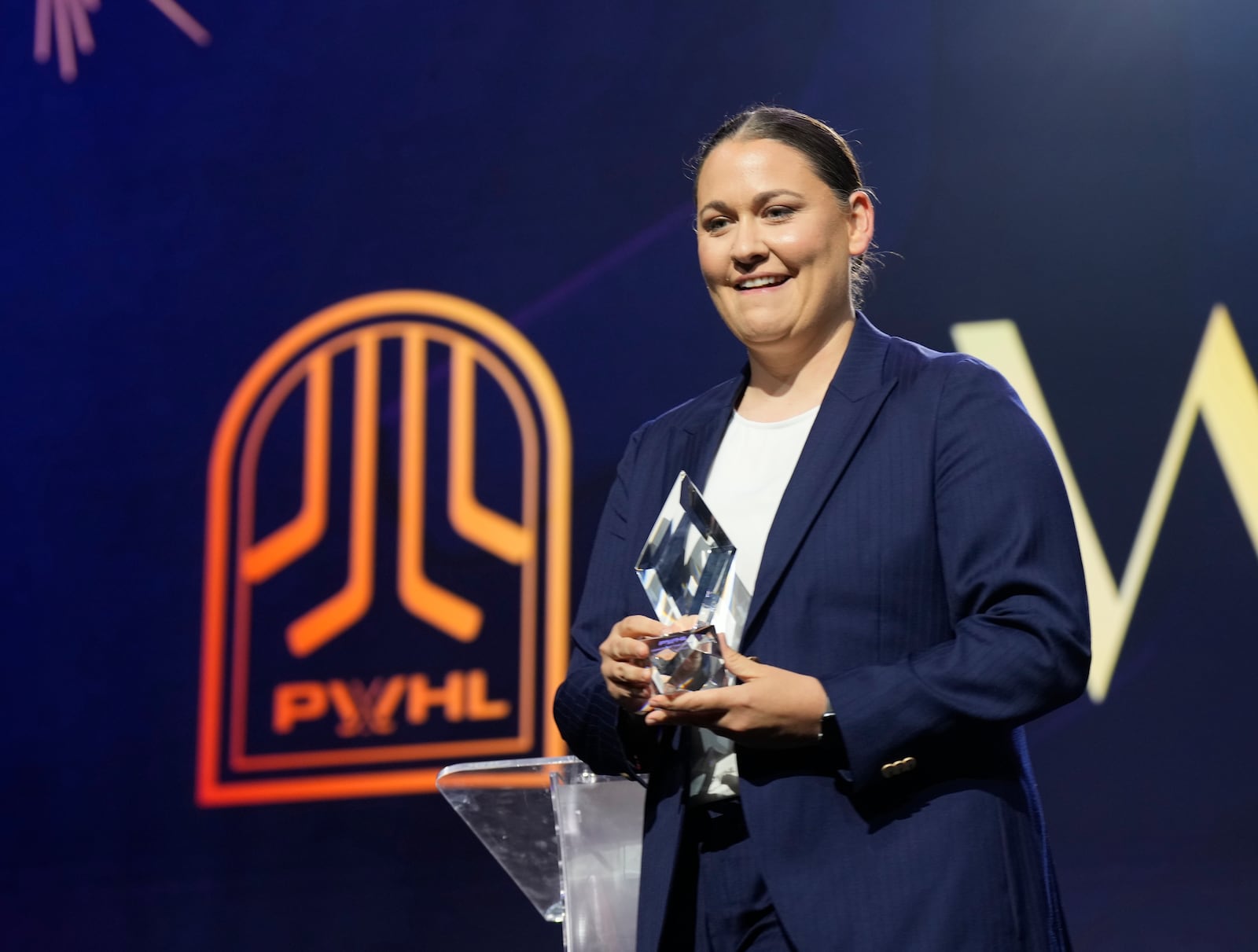 Montreal Victoire head coach Kori Cheverie is named as the Coach of the Year during the PWHL women's hockey awards in Ottawa, Ontario,, Wednesday June 25, 2025. (Adrian Wyld/The Canadian Press via AP)