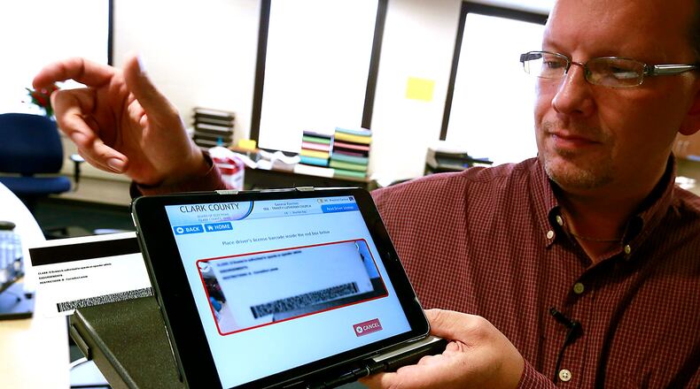 Butler County is moving to electronic poll books, similar to the one pictured here. STAFF FILE PHOTO