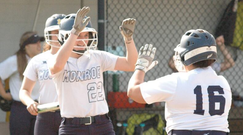 Monroe’s Sam Schwab (22) and Makenzi Moore (16) high-five April 30 during a 1-0 victory over Brookville in Southwestern Buckeye League Southwestern Division play. RICK CASSANO/STAFF