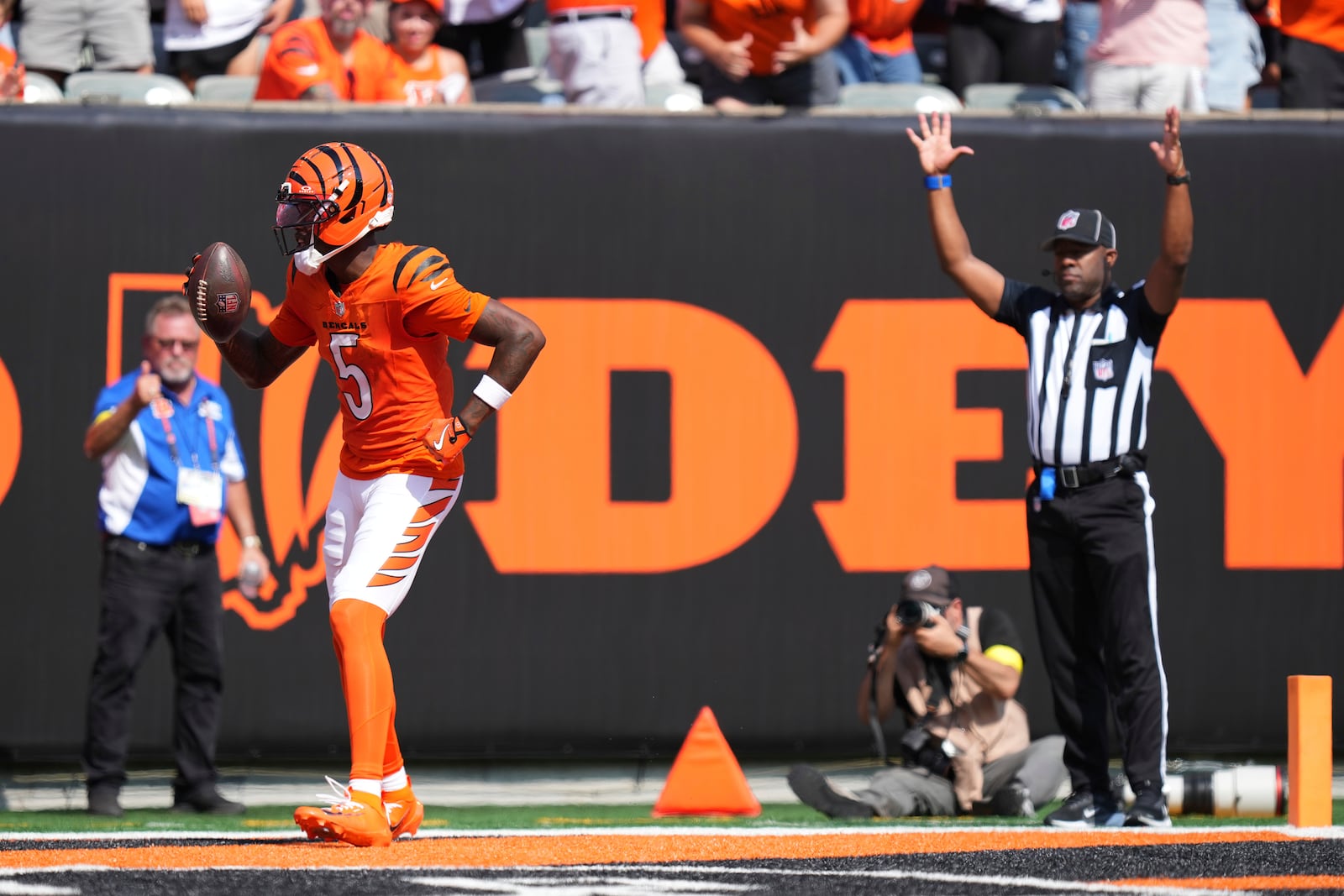 Cincinnati Bengals wide receiver Tee Higgins (5) celebrates his touchdown catch in the end zone during the second half of an NFL football game against the Jacksonville Jaguars, Sunday, Sept. 14, 2025, in Cincinnati. (AP Photo/Jeff Dean)