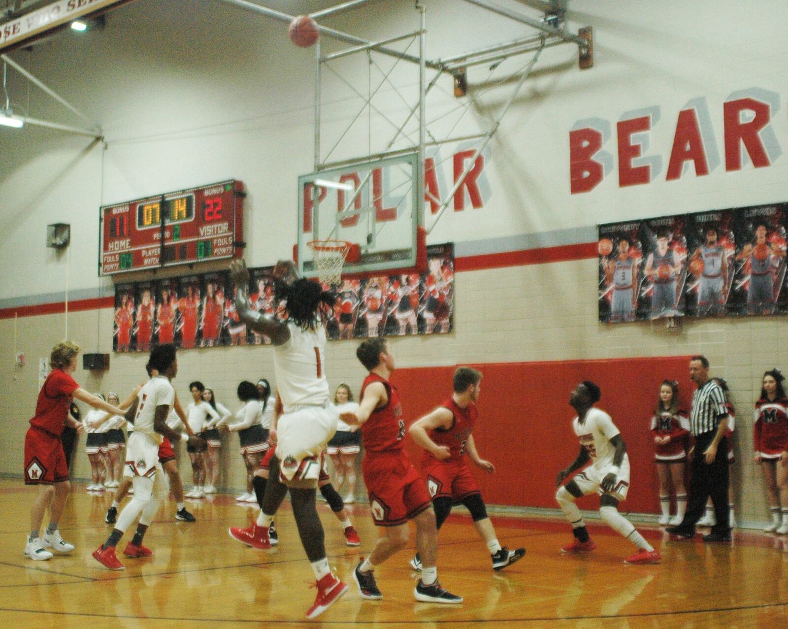 Northridge’s Twon Hines (1) launches a shot over Madison’s Jake Phelps during Saturday night’s game in Harrison Township. Madison won 62-51. RICK CASSANO/STAFF