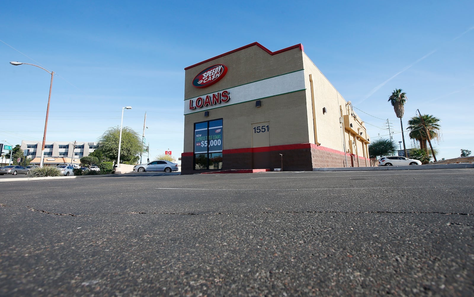 FILE - A sparse parking lot is seen Jan. 18, 2018, in Phoenix, where police say a double homicide previously took place that is linked to Cleophus Cooksey. The double homicide at the location took place on Monday, Nov. 27, 2017. (AP Photo/Ross D. Franklin, File)