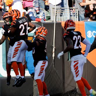 Cincinnati Bengals safety Geno Stone, left, celebrates with teammates after returning an interception for a touchdown during the first half of an NFL football game against the New England Patriots, Sunday, Nov. 23, 2025, in Cincinnati. (AP Photo/Jay LaPrete)