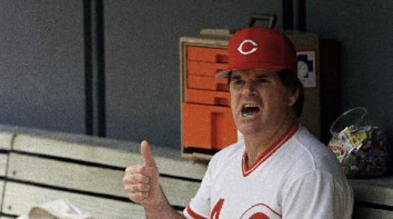In this June 24, 1989, file photo, Cincinnati Reds manager Pete Rose gives a thumbs up sign while sitting in the dugout at Riverfront Stadium in Cincinnati during a baseball game against the Los Angeles Dodgers. . ESPN says it obtained a notebook that shows Rose bet on Reds games during his last season as an active player in 1986. The career hits leader agreed to a lifetime ban from baseball in 1989 after an investigation by John Dowd, a lawyer retained by Major League Baseball, concluded he bet on the Reds to win from 1985-87, during his time as a player and manager. (AP Photo/Rob Burns, File)