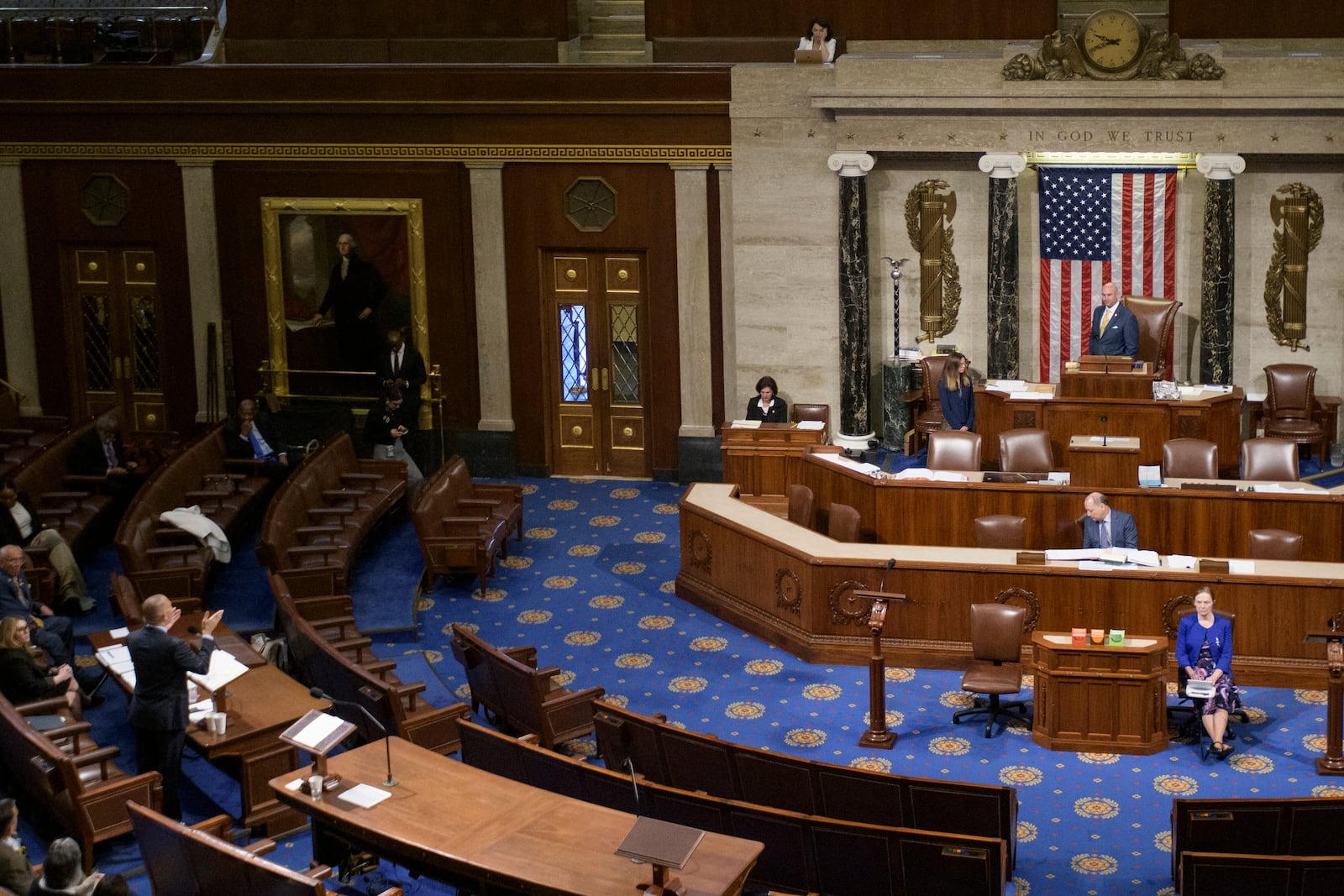 House Minority Leader Hakeem Jeffries, D-N.Y., left, speaks in the House chamber prior to the final vote for President Donald Trump's signature bill of tax breaks and spending cuts, at the Capitol, Thursday, July 3, 2025, in Washington. (AP Photo/Rod Lamkey, Jr.)