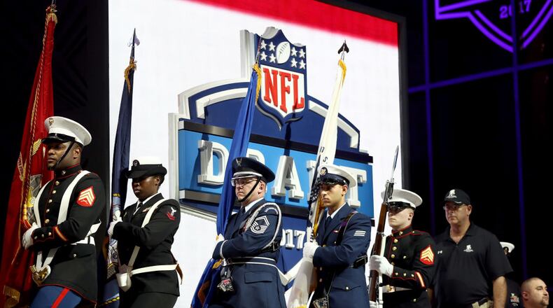 PHILADELPHIA, PA - APRIL 27:  Members of the military march on stage prior to the first round of the 2017 NFL Draft at the Philadelphia Museum of Art on April 27, 2017 in Philadelphia, Pennsylvania.  (Photo by Elsa/Getty Images)