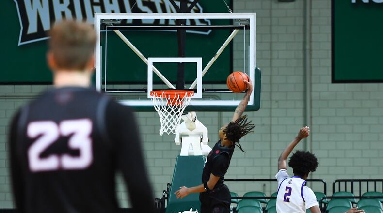 Lakota West High School's Bryce Curry dunks during their game against Reynoldsburg on Sunday afternoon at the Wright State University Ervin J. Nutter Center. KYLE HENDRIX/CONTRIBUTED