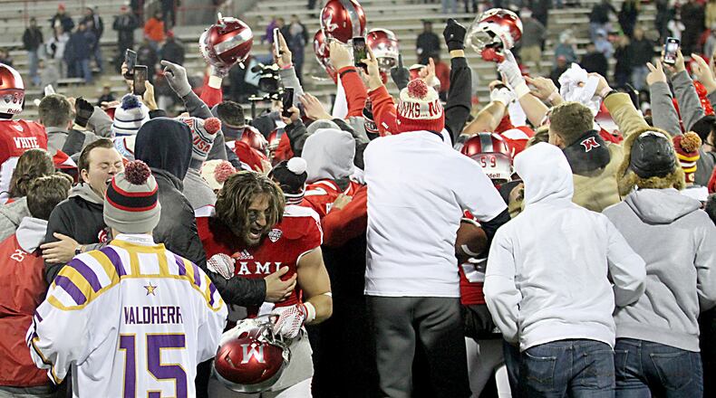 Contributed photo by E.L. Hubbard Students and fans celebrate with the RedHawk football team on the field after Miami beat Ball State, for their sixth straight win, at Yager Stadium in Oxford Tuesday, Nov. 22, 2016.