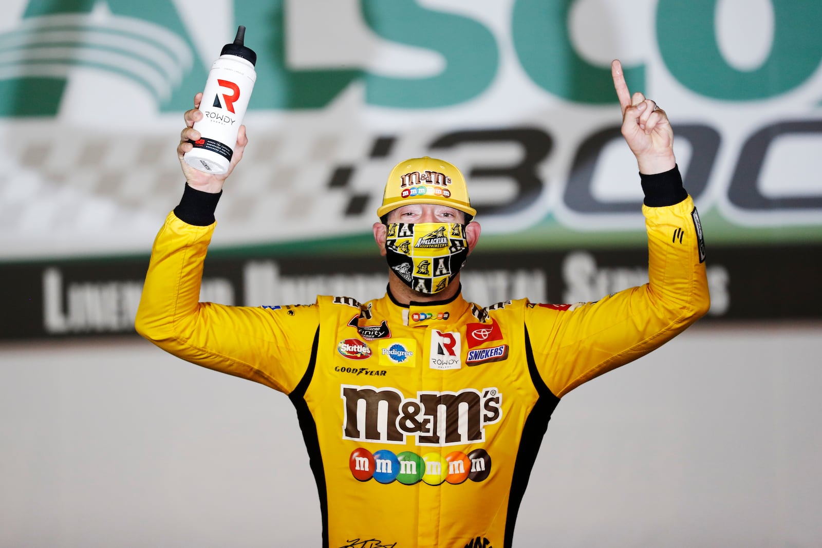 FILE - Kyle Busch (54) celebrates after winning the NASCAR Xfinity Series auto race at Charlotte Motor Speedway, May 25, 2020, in Concord, N.C. (AP Photo/Gerry Broome, file)