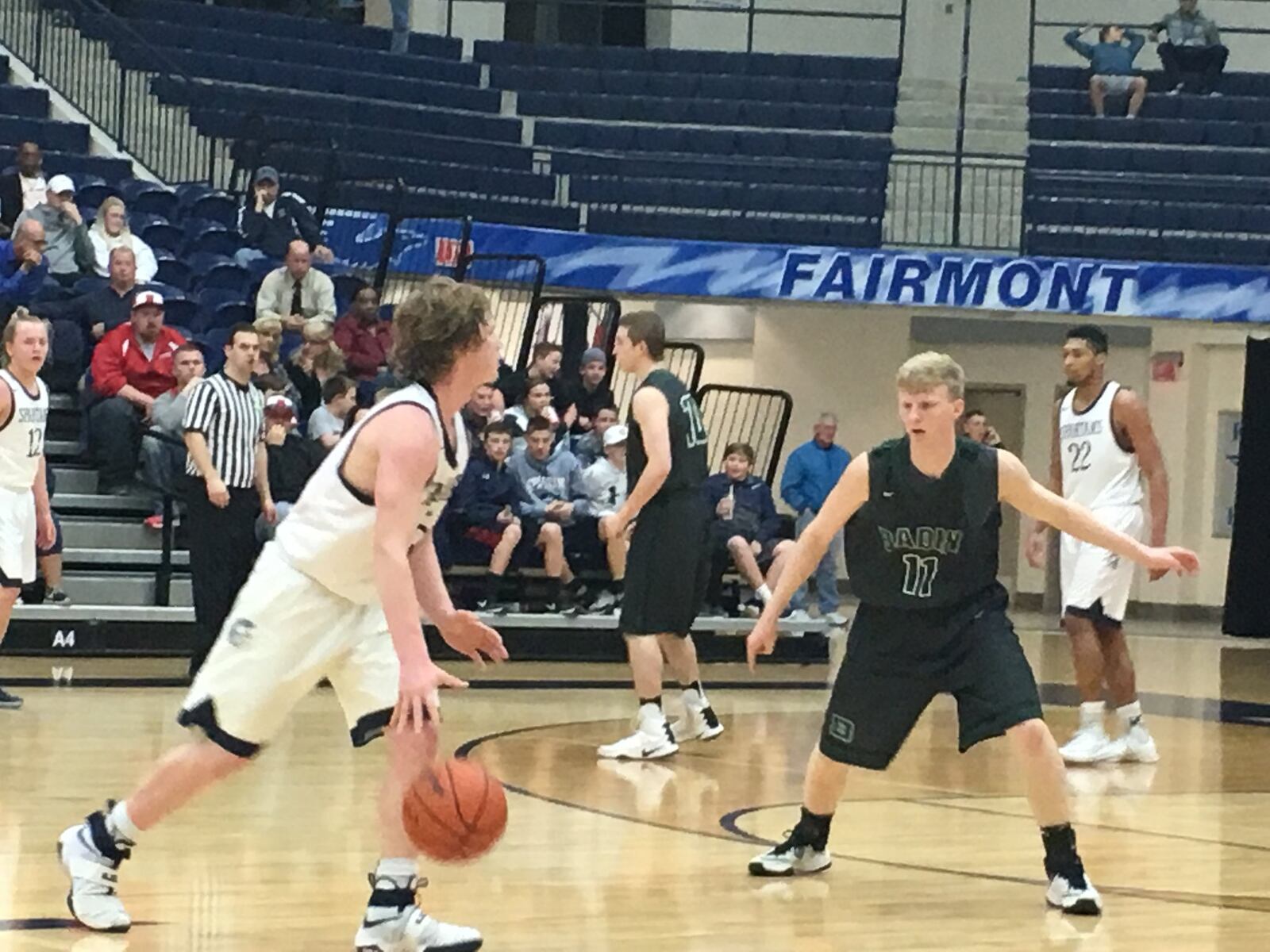 Badin’s Kyle Young (11) keeps an eye on Valley View’s Clayton Erbaugh (5) during Tuesday night’s Division II sectional semifinal at Fairmont’s Trent Arena. RICK CASSANO/STAFF