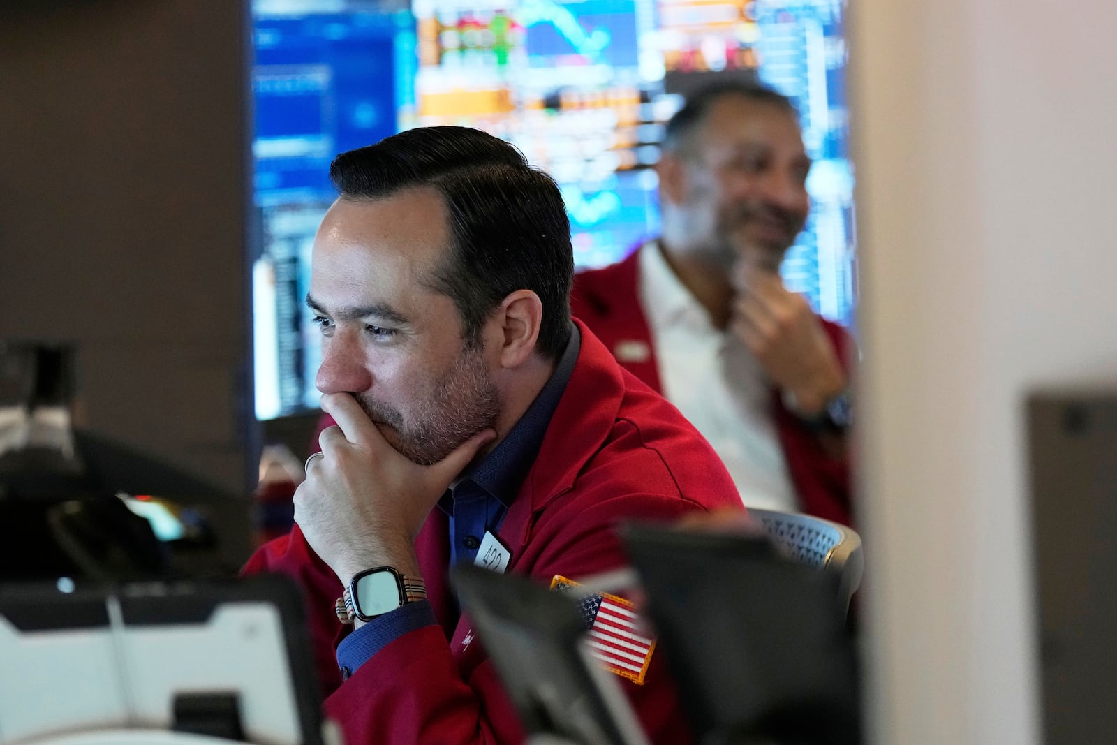Robert Greason works on the floor at the New York Stock Exchange in New York, Monday, July 14, 2025. (AP Photo/Seth Wenig)