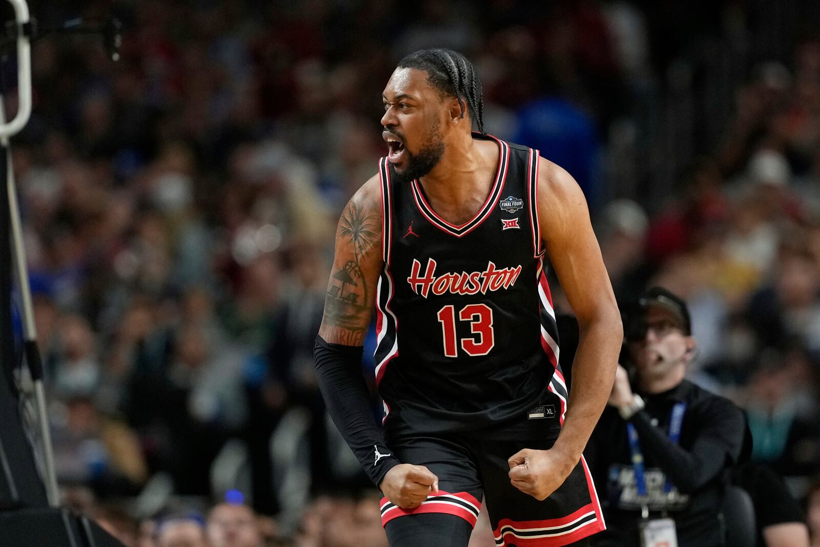 Houston's J'Wan Roberts (13) reacts during the first half in the national semifinals at the Final Four of the NCAA college basketball tournament, Saturday, April 5, 2025, in San Antonio. (AP Photo/Eric Gay)