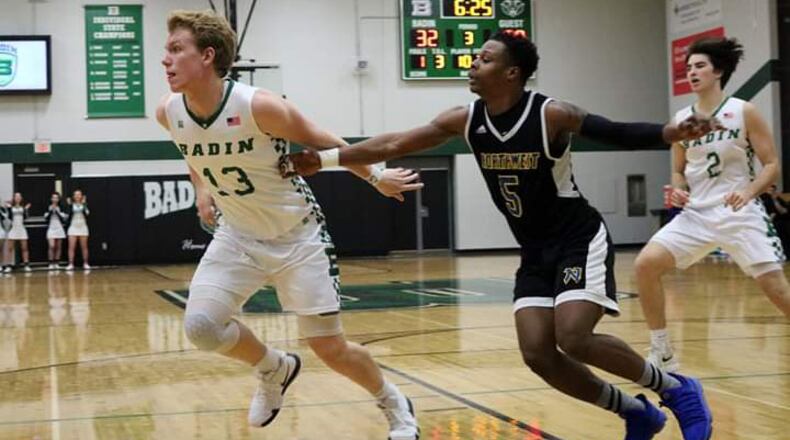 Badin’s Justin Pappas (13) and Northwest’s Dae’Mon Cherry (5) go after the ball Tuesday night at Mulcahey Gym in Hamilton. Badin won 70-52. CONTRIBUTED PHOTO BY TERRI ADAMS