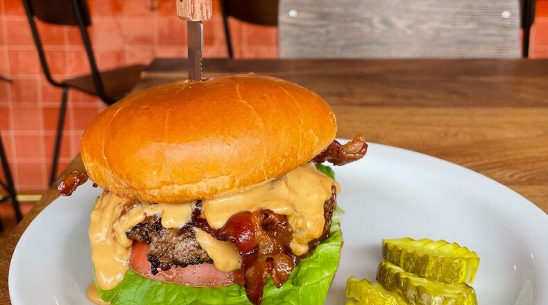 Rusk Kitchen + Bar's "The King" burger is 1/3 pound smashburger, peanut butter, bacon, sweet onion jam, lettuce and tomato. Rusk is located at 2724 Woodburn Avw. in Walnut Hills, Cincinnati. CONTRIBUTED/CINCINNATI BURGER WEEK