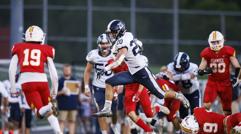 Edgewood's Jake Valerio runs the ball against Fenwick on Friday. Sept. 9, 2022. The Cougars beat the Falcons 10-0. Nick Graham/STAFF
