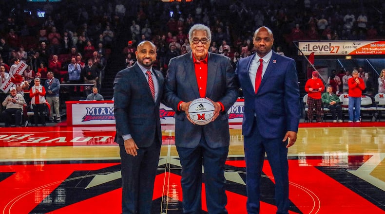 Wayne Embry is presented with a basketball on Wayne Embry Day on Saturday at Millett Hall in Oxford. Embry, a 1958 Miami grad, ranks 12th all-time on Miami’s scoring list and second in rebounds. Embry is in the Miami Hall of Fame and the College Basketball Hall of Fame. After a successful NBA career, he became the first African-American general manager in NBA history. He was elected to the Naismith Hall of Fame in 1999 for his on and off the court accomplishments. Embry (center) is pictured with Miami head coach Jack Owens (left) and Miami assistant Damon Frierson. CONTRIBUTED