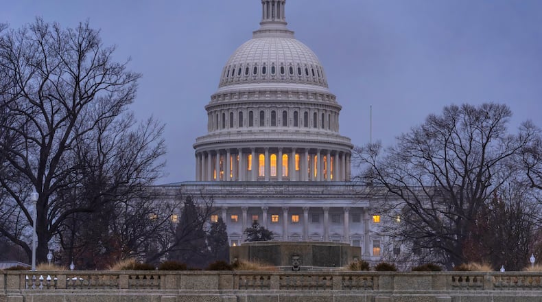 The Capitol is seen during heavy rain as the Department of Homeland Security funding bill remains in limbo, in Washington, Friday, Feb. 20, 2026. (AP Photo/J. Scott Applewhite)