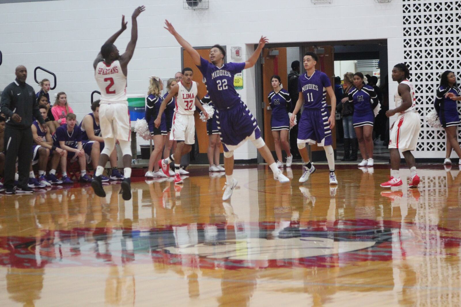 Middletown’s Christian Strother (22) can’t quite block a shot by Lima Senior’s Jarius Ward (2) during Friday night’s game in Lima. CONTRIBUTED PHOTO BY MARITZA MCKINNEY