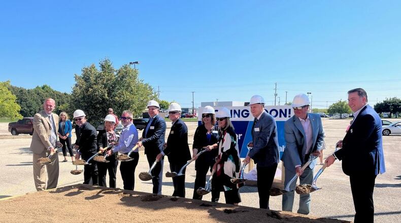 Officials from Kroger, Reid Health and city of Eaton held a ceremony Monday for a new Kroger store in Eaton. CONTRIBUTED