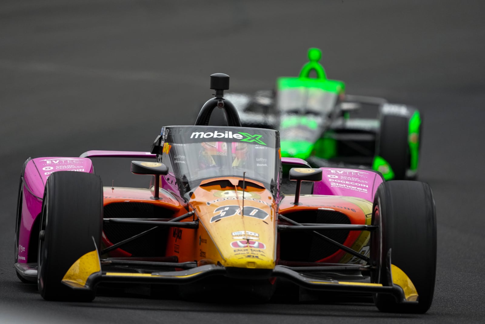 Devlin DeFrancesco, of Canada, heads into the first turn during of the Indianapolis 500 auto race at Indianapolis Motor Speedway in Indianapolis, Sunday, May 25, 2025. (AP Photo/AJ Mast)