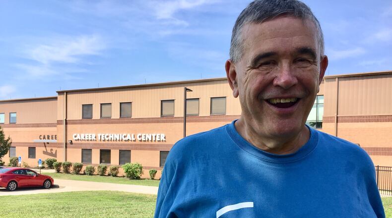 Hamilton Board of Education member Tom Alf says he has waited nearly a half century to see the upcoming Butler Tech merger with the city schools. Starting at the school district’s opening of classes in August, Butler Tech will offer its career education programs at Hamilton’s former Career Technical Center building on district’s high school campus. (Photo by Michael D. Clark/Journal-News)
