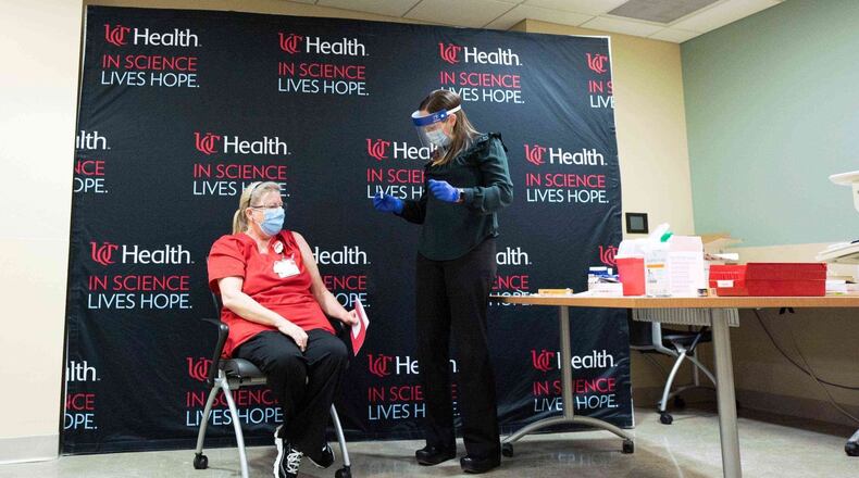 Kim Murphy, a registered nurse who works at West Chester Hospital's Intensive Care Unit was the first in Butler County to receive the novel coronavirus vaccine on Tuesday, Dec. 15, 2020. "Taking the vaccination is the best route I can take as a person,” Murphy said. “We need to just stand up and do what we need to do to make our community better. As an RN, I want to model for the community as this is what we should do, and people can see us taking the vaccine, and that we are going to be okay — and so will they.” PROVIDED/UC HEALTH
