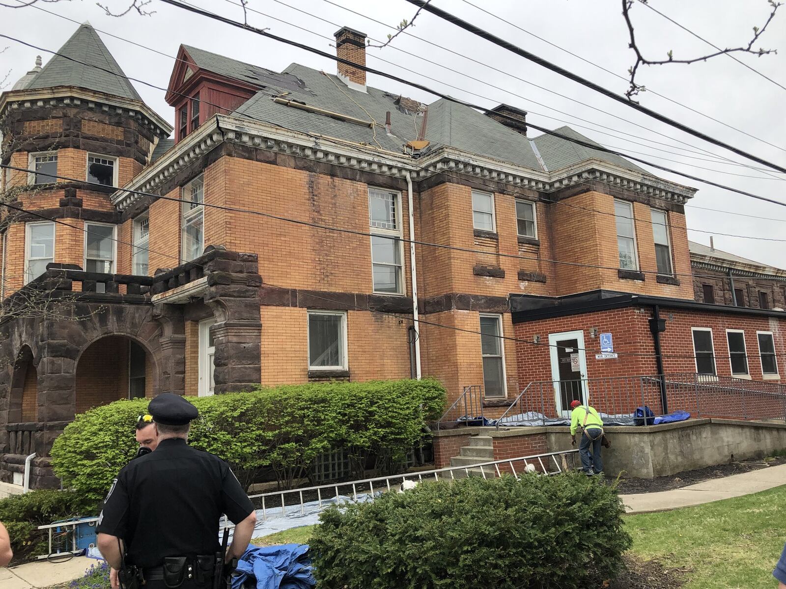 Two workers were treated at Atrium Medical Center after being shocked while working on the roof at the old Warren County Jail and Sheriff’s Office. STAFF/LAWRENCE BUDD