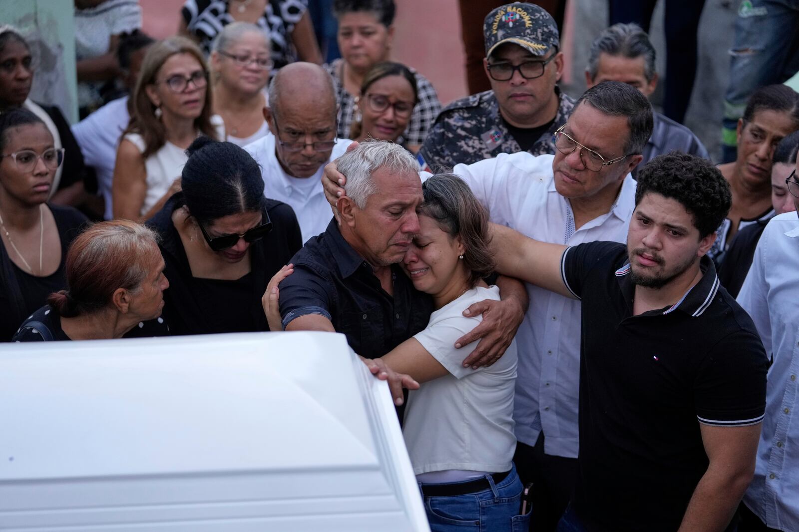 Family and friends attend the funeral of Marilenny Pilarte who died at the Jet Set nightclub when its roof collapsed, in Haina, Dominican Republic, Thursday, April 10, 2025. (AP Photo/Matias Delacroix)