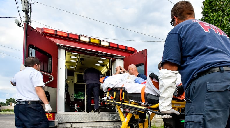 In this June file photo, Middletown paramedics and police officers responded to a drug overdose. NICK GRAHAM/STAFF
